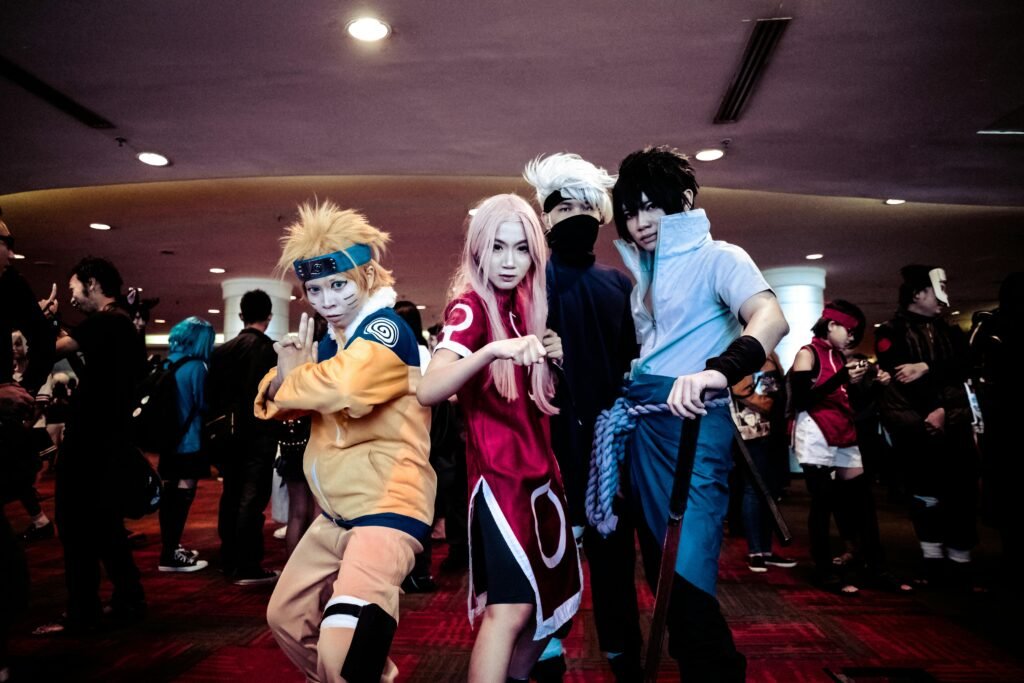 group of cosplayers in colorful costumes at an indoor event.
