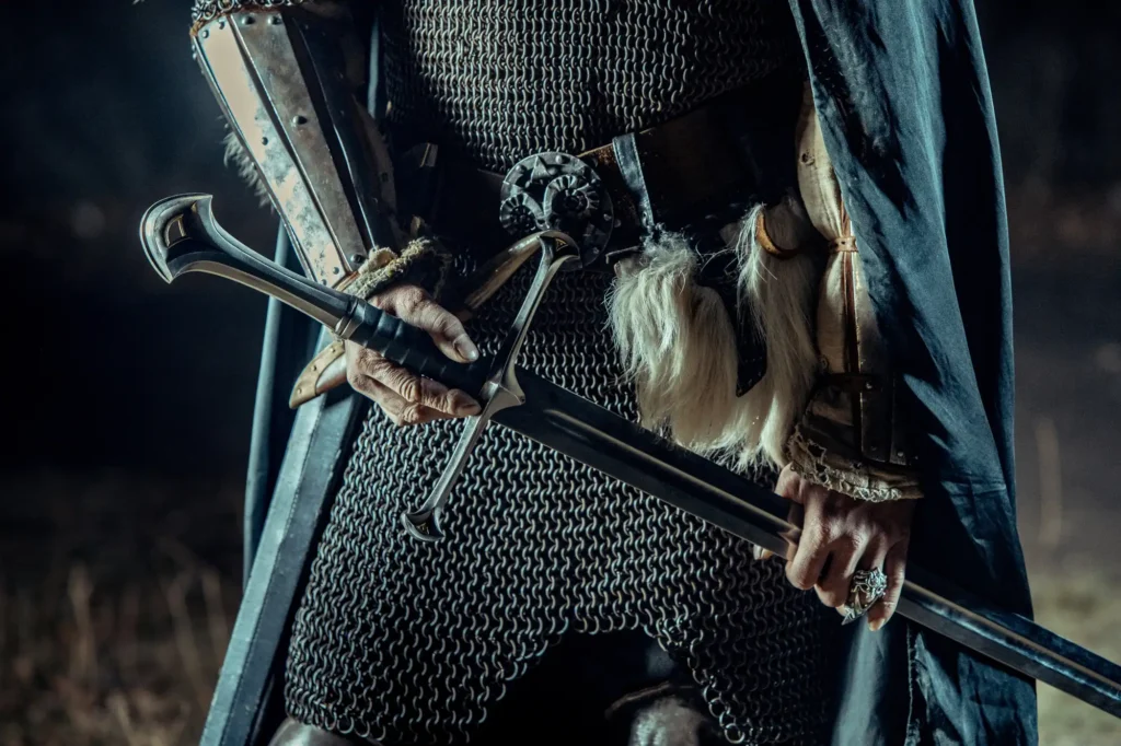 Knight in armor holding a fantasy sword.