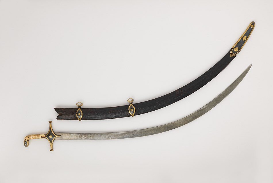 Persian Shamshir sword with scabbard, highlighting its curved blade and ornate decorations.