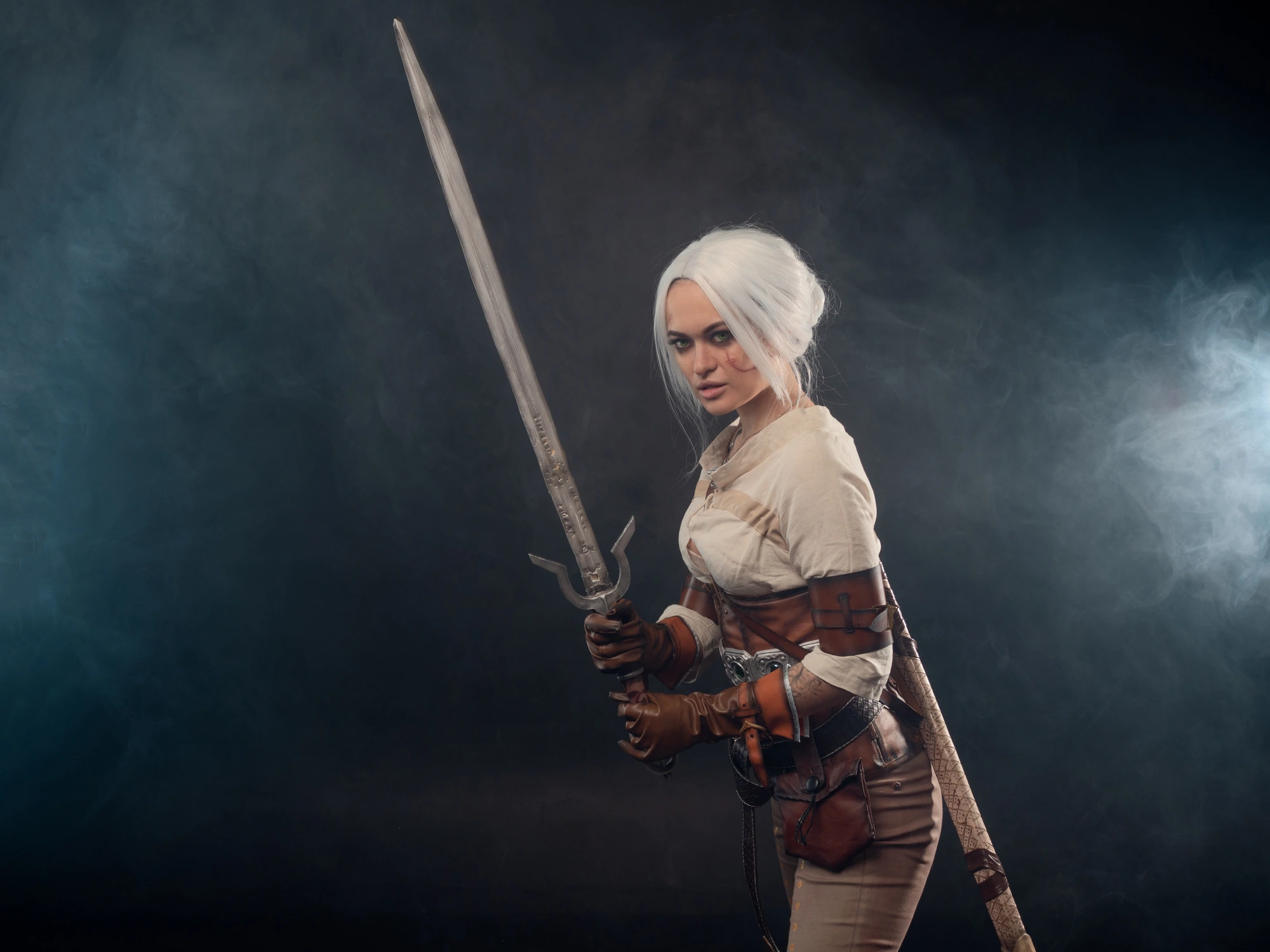 A girl with a fantasy sword replica.