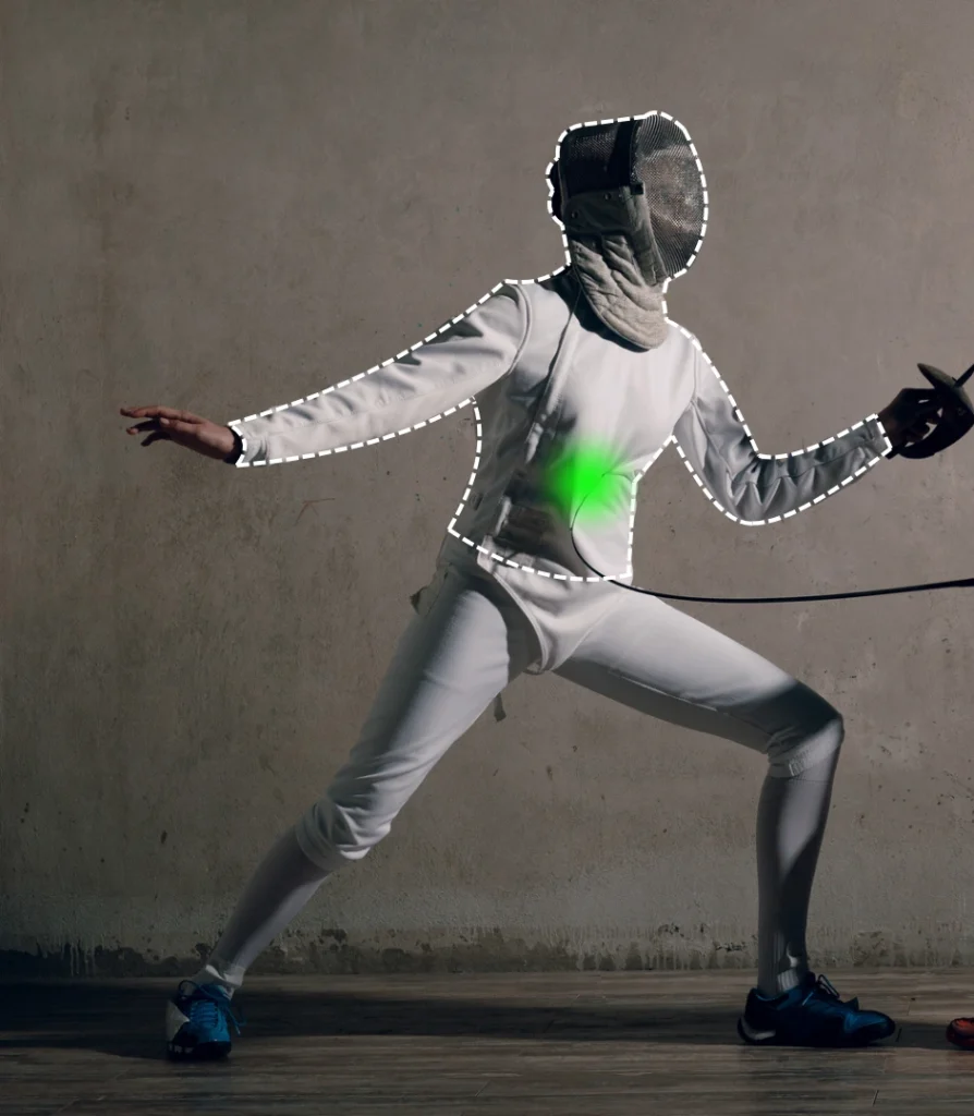 A fencer in gear with a highlighted green target area on the torso.