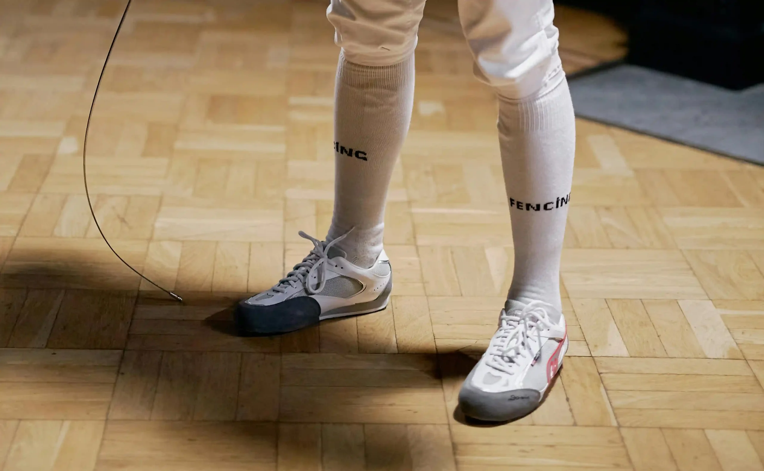 Fencer wearing do-win fencing shoes