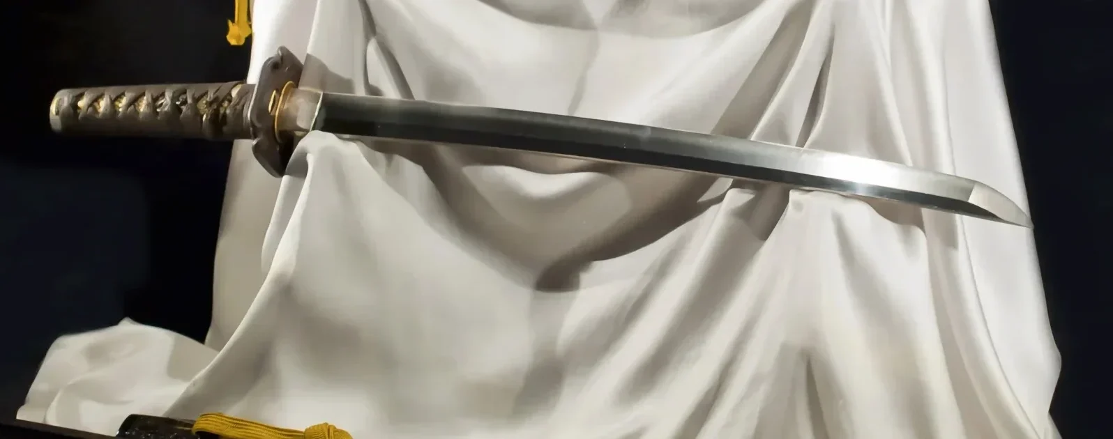 Japanese samurai wakizashi displayed in a stander and highlighted by lightings with all the battle ready fittings