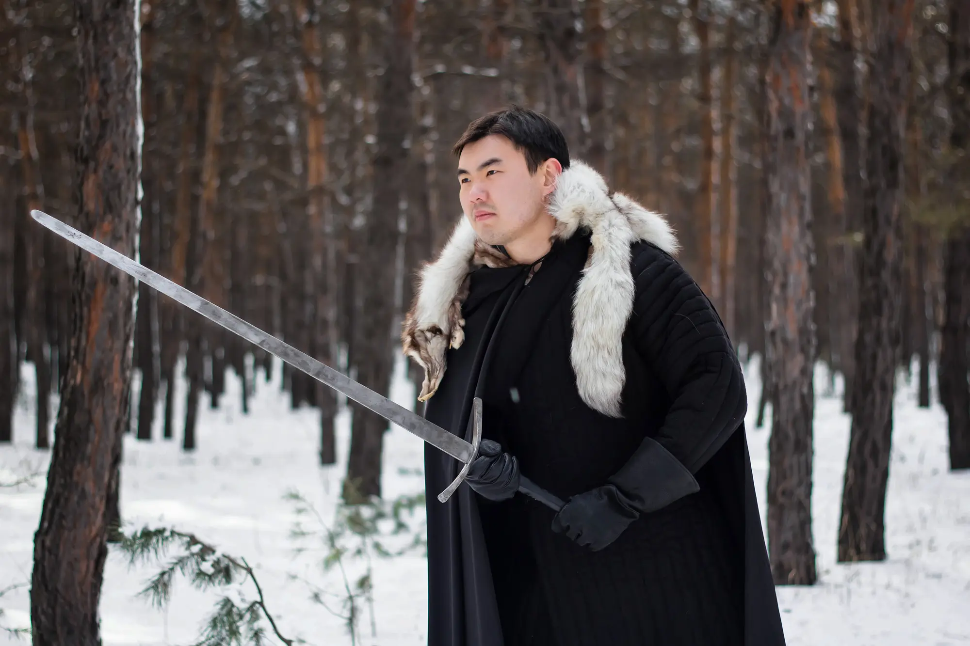 A person holding a longsword.