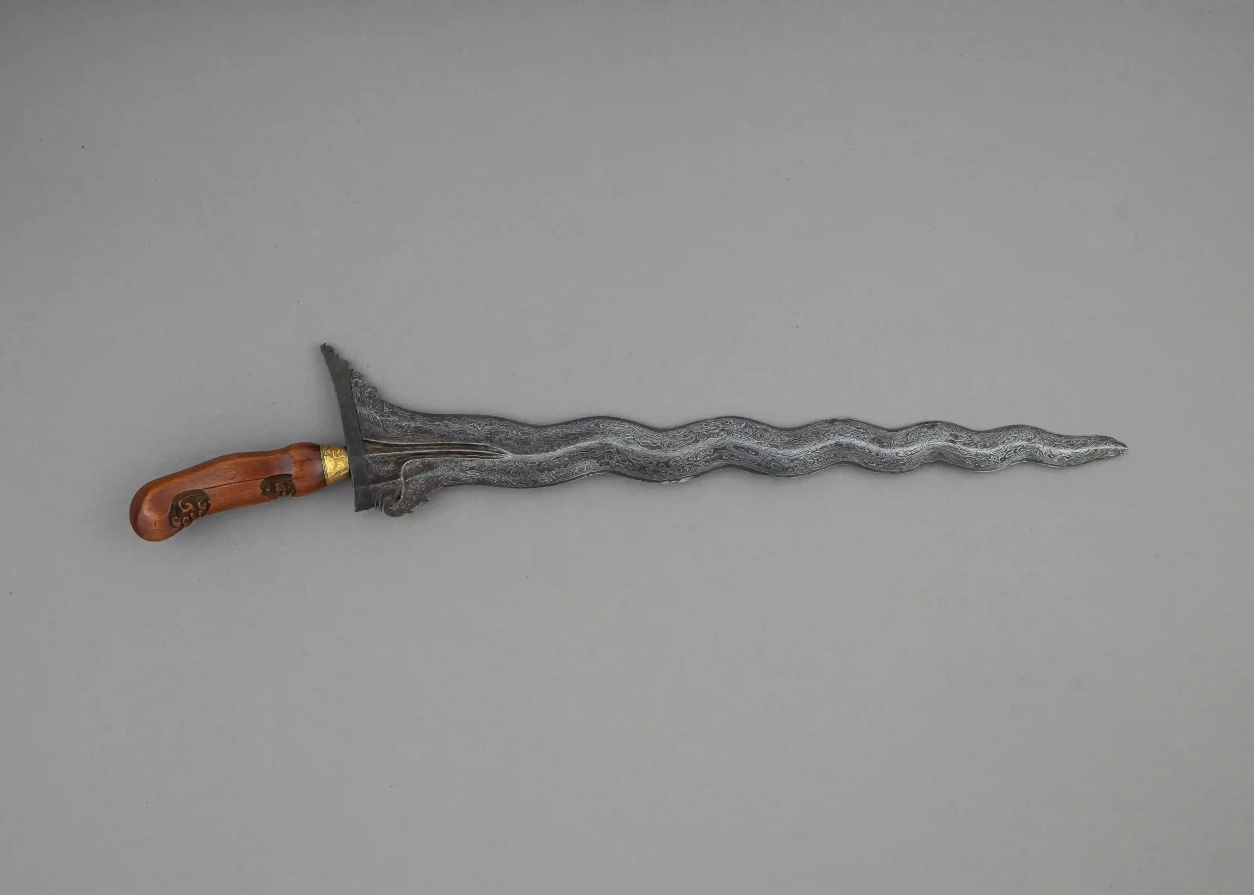Kris sword with a Damascus wavy blade