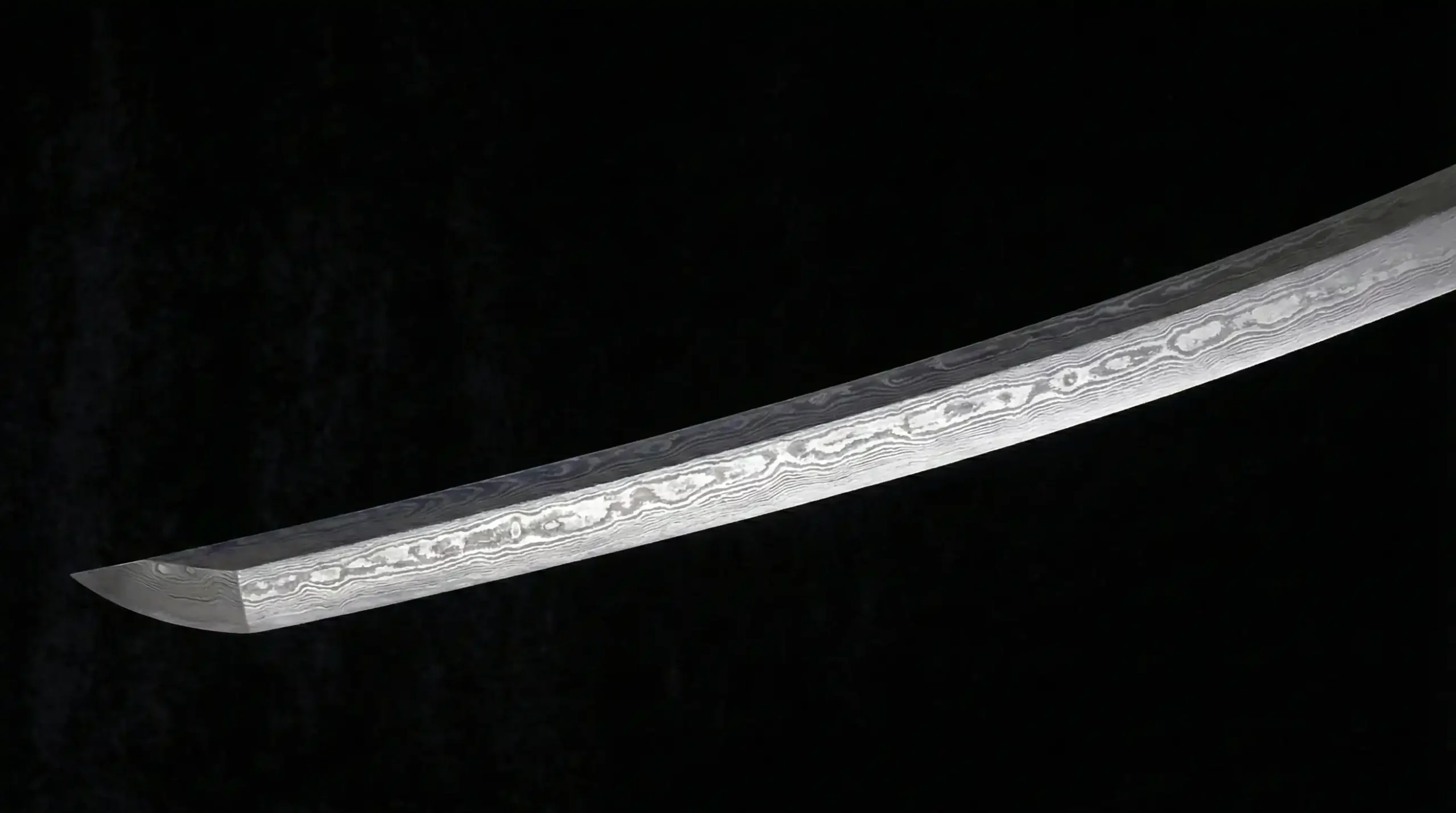 The blade of a katana made of folded steel